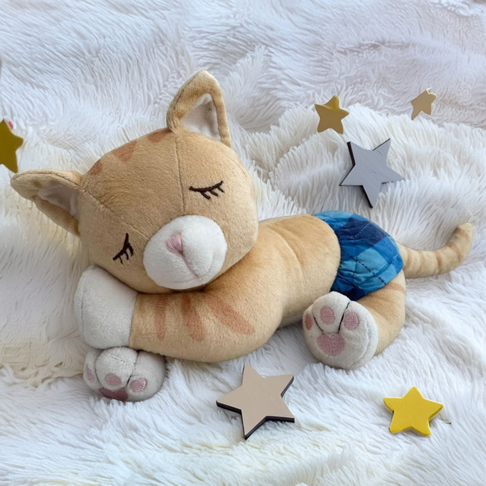 Sweet Dreams Reecie plush toy on fluffy white blanket with decorative wooden stars